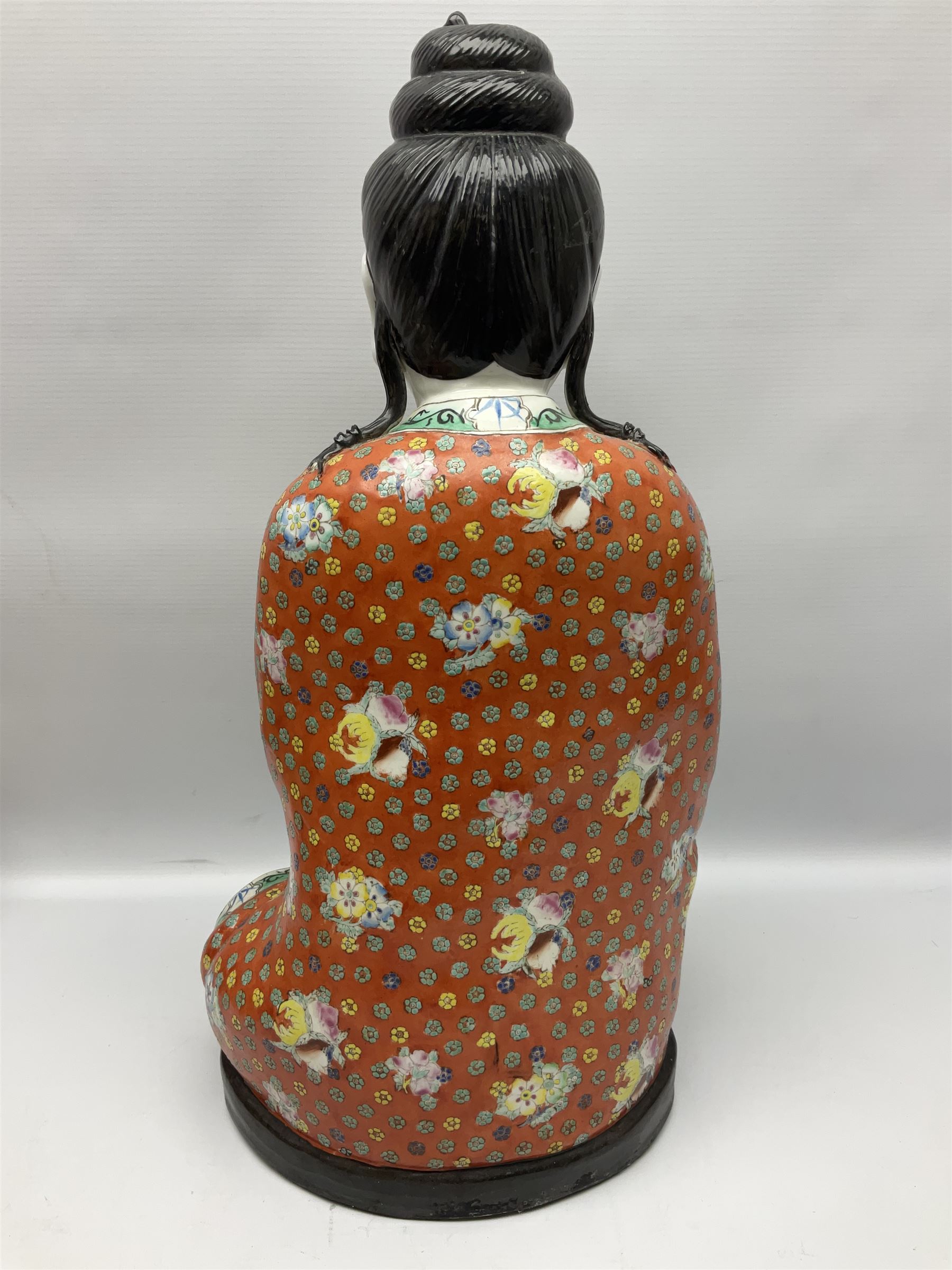 Tall Chinese polychrome figure of Guanyin (Guan Yin), the Goddess of Mercy and compassion, the Bodhisattva modelled seated and holding a rosary donning elaborate floral robes and beads, with four character seal marks beneath, H53cm