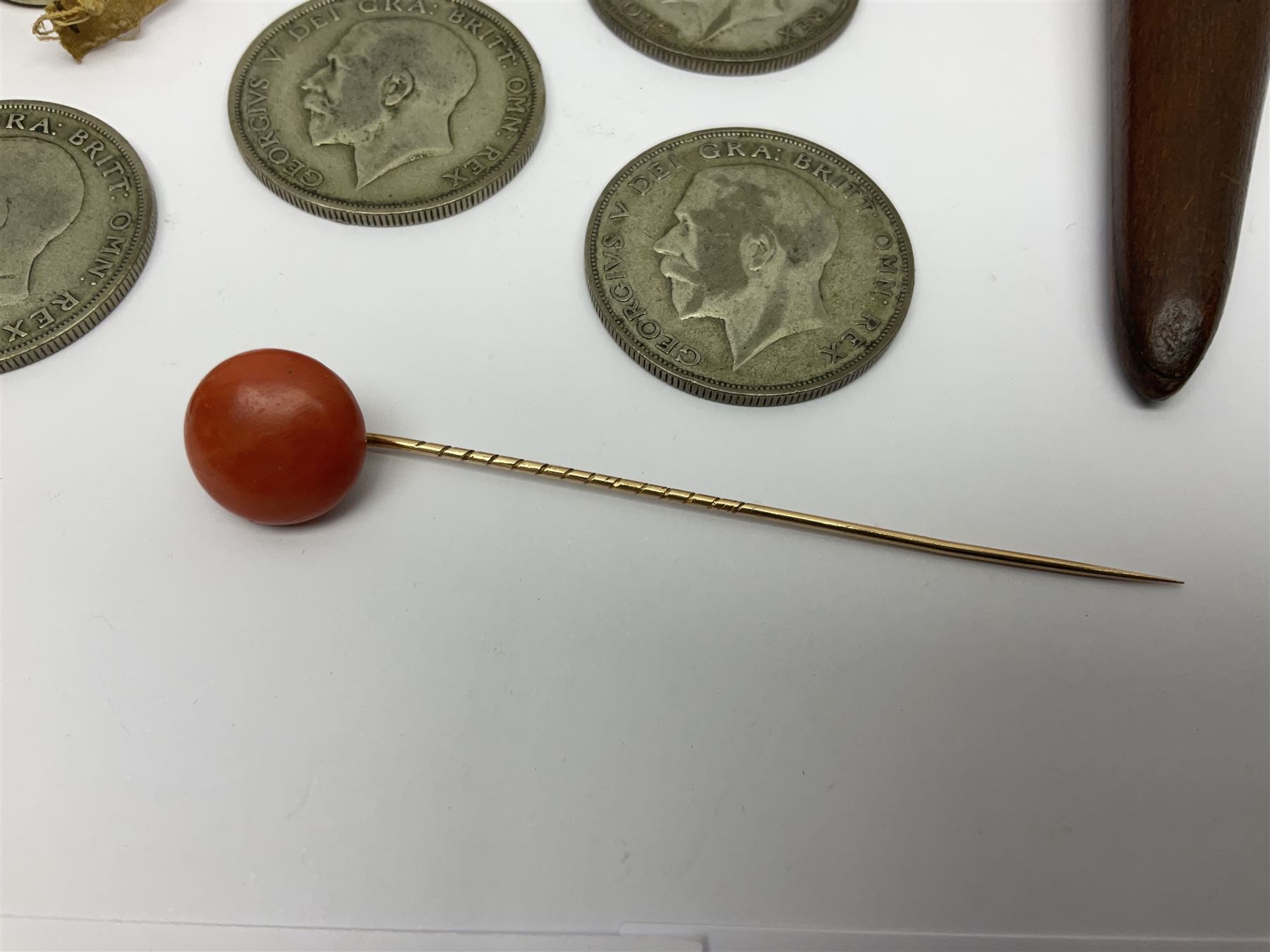 14ct gold coral stick pin, together with six pre-1947 silver halfcrown coins, silver napkin ring, silver mounted pen and other collectables