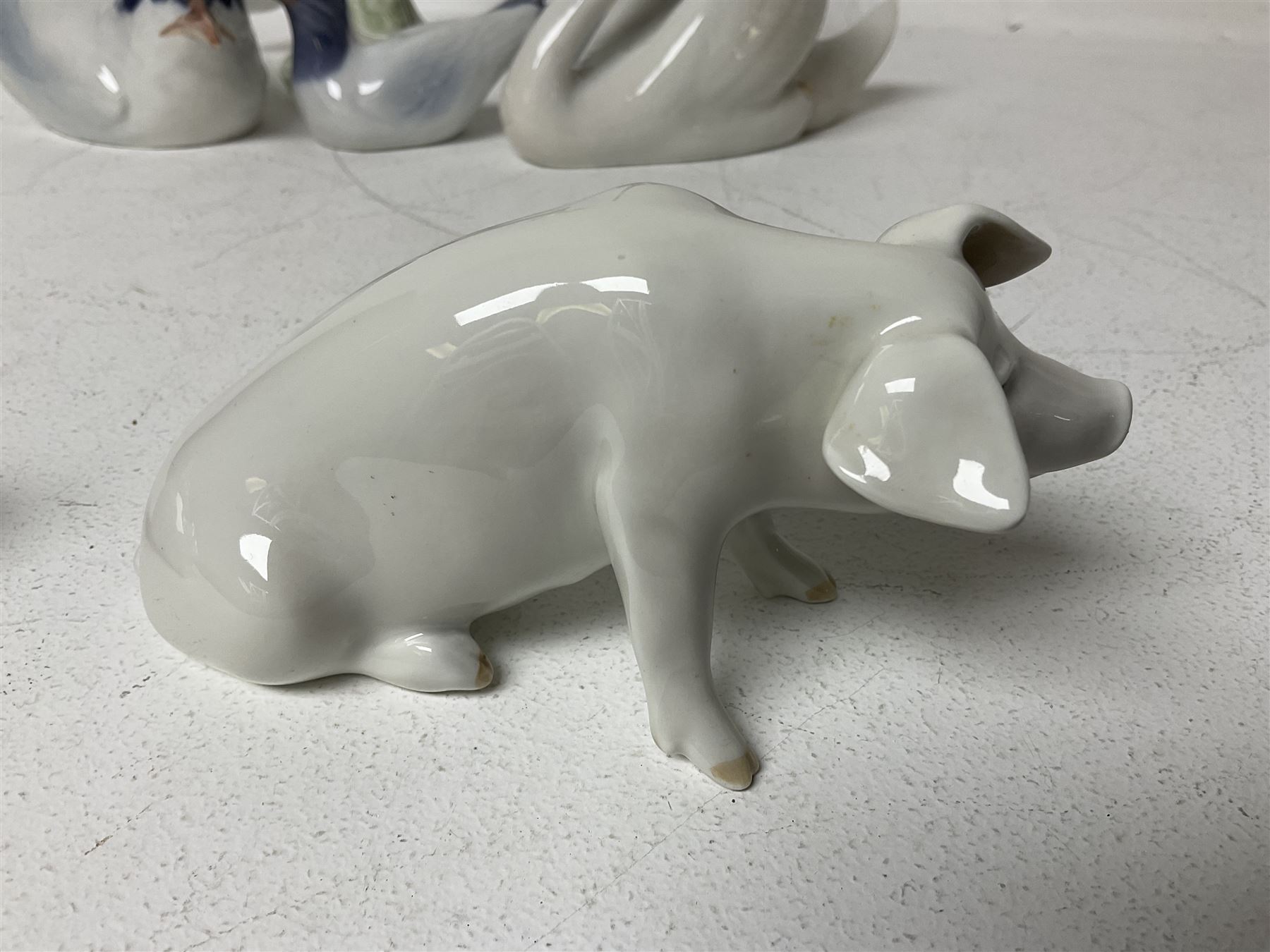 Seven Royal Copenhagen figures, including Arctic tern no 827, Swan no 755, Kingfisher no 2257 etc, together with Royal Copenhagen dish