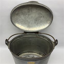 Late 19th/early 20th century steel and brass dairy pail or can, of oval form with swing handle, brass plaque to front and hinged cover inscribed 'F & T Ross Ltd Dairy Outfitters Hull', and 'New Milk F Clappison Dairy Farmer Hull', not including handle H30cm