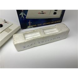 Three late 70s/early 80s handheld electronic games; Bandai Electronics Arcade ‘Gunfighter’ (1980), Grandstand ‘Invader From Space’ (1980), Palitoy ‘Merlin The Electronic Game Machine’ (1979) with game sheet and instruction booklet, all with original boxes (3) 