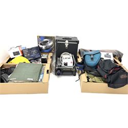 Large quantity of camera equipment in three boxes - Lumix GX1 camera, Canon EOS 500 camera, Lumix FZ100 camera, Pantax  MZ5n, various other cameras, Swift spotting Scope 20 x 60 in box,  Maxtor hard drive, three tripods, Kodak carousel projector, Pradolux slide projector, a selection of camera bags and other camera equipment. 