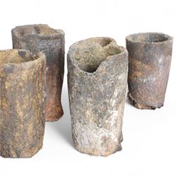 Nine lava stone iron smelting crucible pots in various conditions