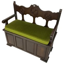 20th century stained beech hall bench or pew, the back carved with stylised rosettes, over hinged box seat, with loose seat cushion