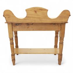 20th century pine washstand, shaped three-quarter gallery back over rectangular top, raised on turned supports with lower undertier