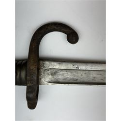 WWI French Chassepot Sword bayonet 57cm steel blade inscribed to the back-edge 'Tulle Juillet 1874', the cross-guard with indistinctly impressed number, in its steel scabbard, L71cm