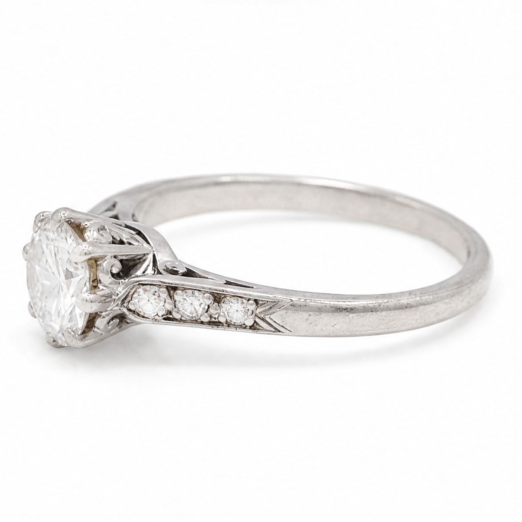 Platinum diamond ring, single round brilliant cut diamond of approx 0.85 carat, with diamond set shoulders, stamped Plat