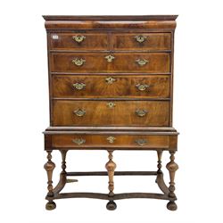 18th century and later walnut chest on stand, the chest fitted with cushion frieze drawer over two short and three long drawers, the stand fitted with single long drawer, raised on turned supports joined by shaped stretcher rails