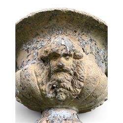 19th century terracotta campana shape urn planter, egg-and-dart moulded rim over a cherub-mask and gadrooned underbelly, turned pedestal and socle on square base