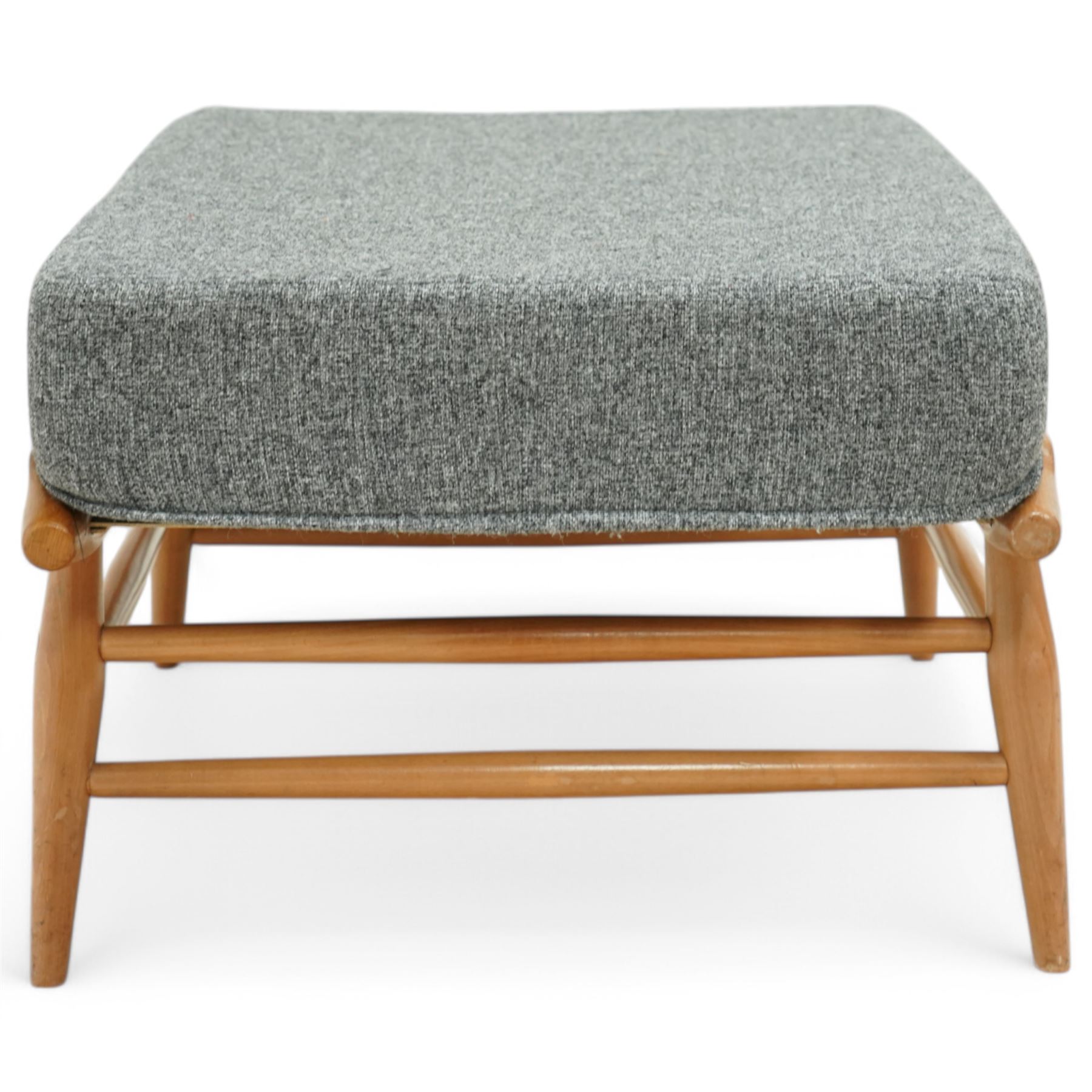 Lucian Ercolani for Ercol - footstool model number 443, upholstered in grey fabric, on elm and beech base 
