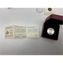 Royal Canadian Mint 2019 'Queen Elizabeth Rose Blossoms' three dollar fine silver coin cased with certificate, 2012 and 2013 'Christmas Silver Coin Pair' twenty dollars fine silver coins in a case with certificate and a 2011 twenty dollars fine silver coin with certificate 