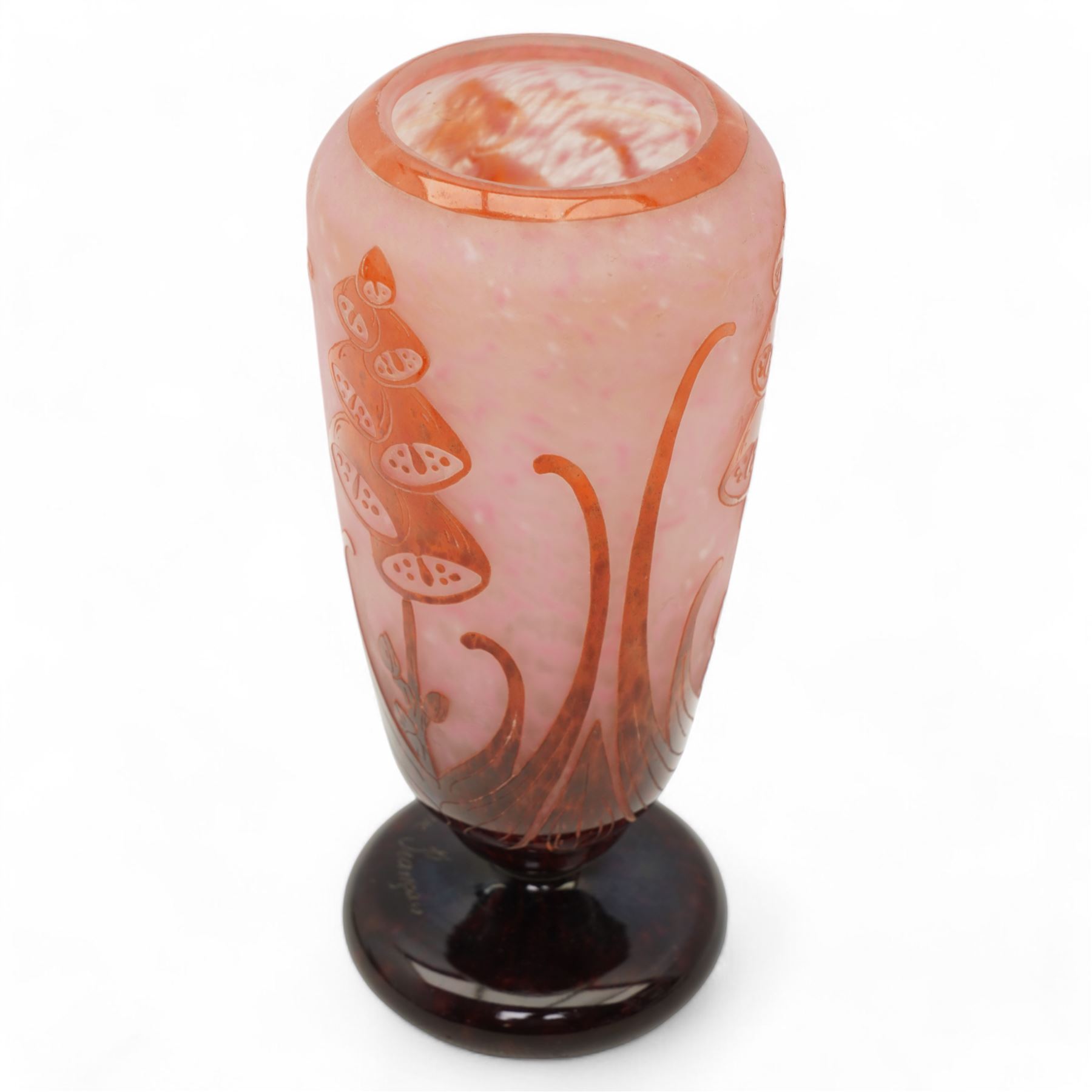Le Verre Français, overlaid and etched cameo glass vase, circa 1920, internally mottled with pink and overlaid in amethyst with stylized floral decoration, the pedestal foot signed Le Verre Français, H26cm x D10.5cm 