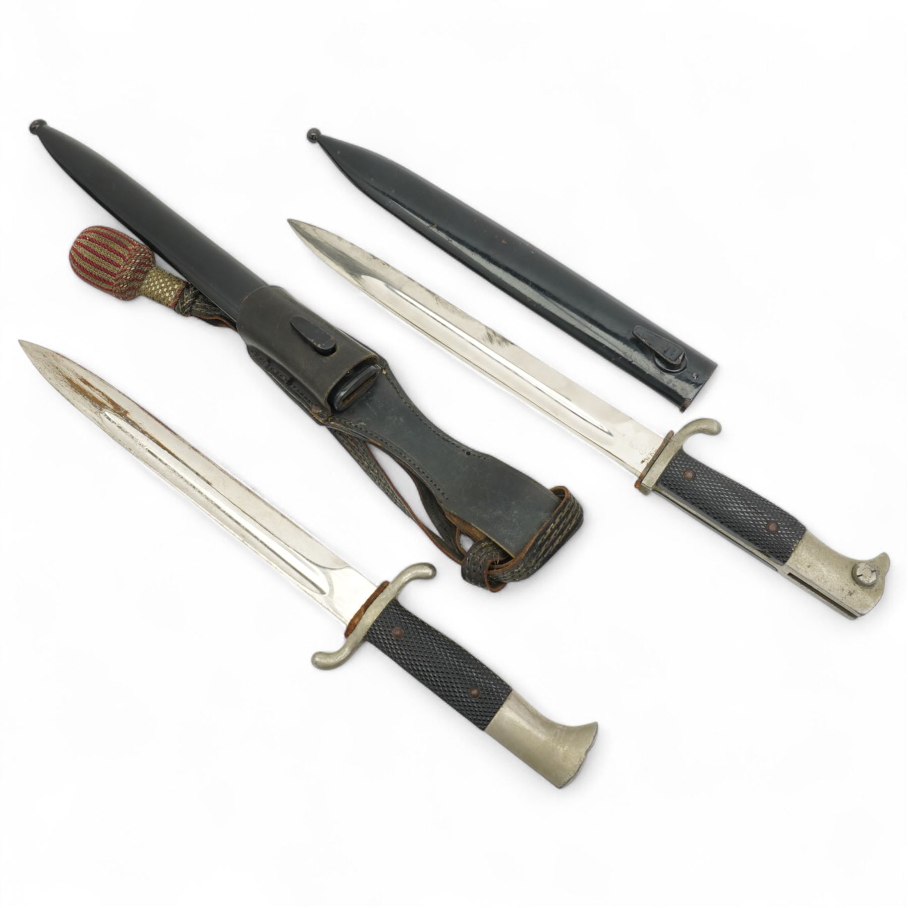 German Third Reich parade bayonet, the ricasso marked WKC with hatched grip and black scabbard and another  with dress knot (2)