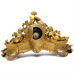 French-large late 19th-century 8-day Louis XV style gilt bronze mantel clock, with a cast rococo style case, elaborate C-scrolls, shells, and floral sprays, surmounted by a seated putto and goat symbolising pastoral love, flanked by two further seated putti on a scrolled foliate base, 5