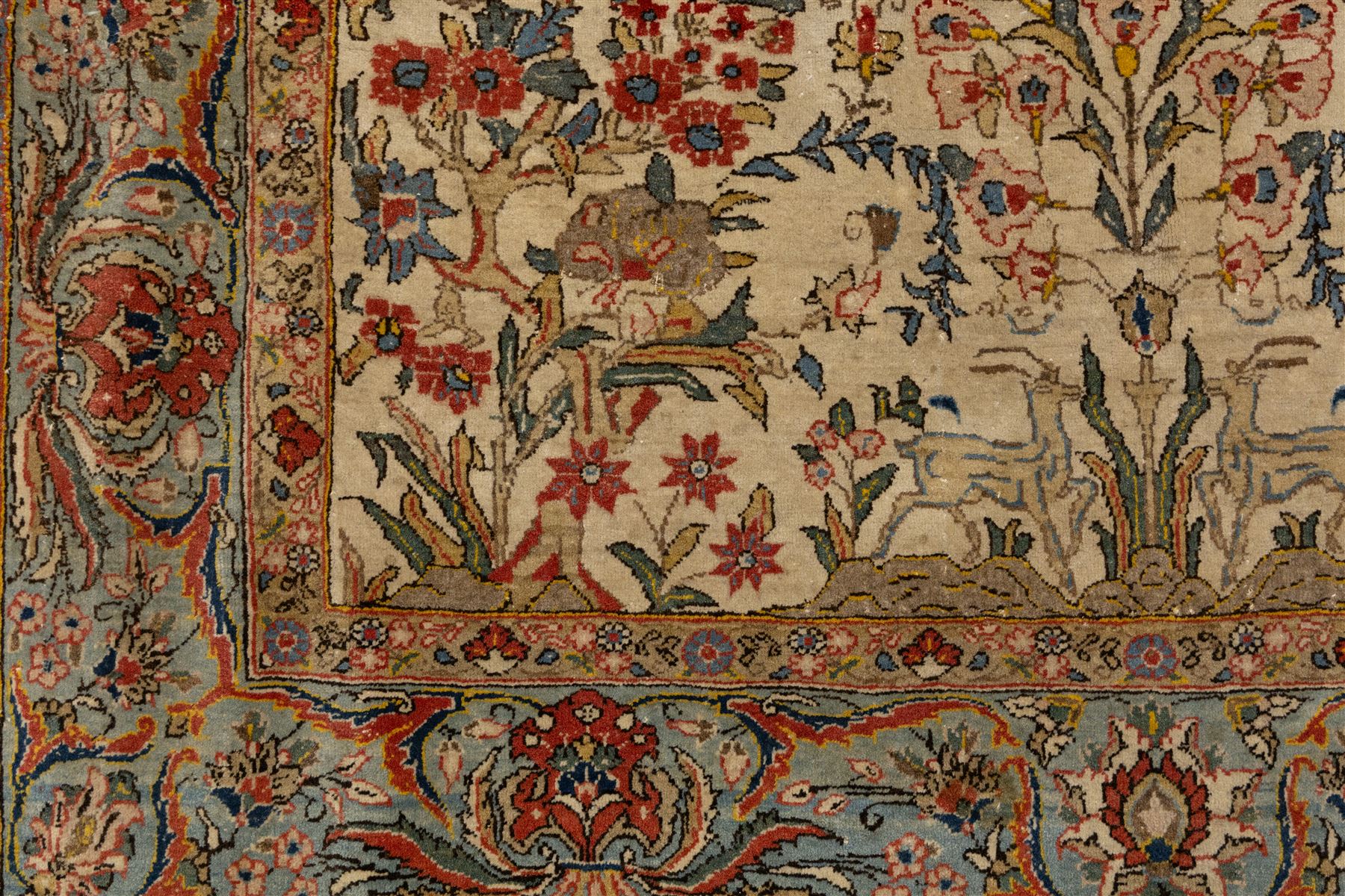 Persian pictorial Kashan rug, ivory field woven with a central tree of life surrounded by flowering plants, birds, and animals, enclosed by a broad turquoise border with scrolling foliage and palmettes