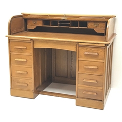  Early 20th century light oak twin pedestal tambour roll top desk, fitted interior, two slides, single frieze flanked by eight drawers, plinth base, W122cm, H101cm, D68cm  