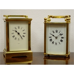  French brass carriage timepiece with bevelled glass panels and white Roman dial on ball feet, H14cm and a brass Carriage timepiece, white Roman dial inscribed A. Fattorini Harrogate, in case, H15cm (2)    
