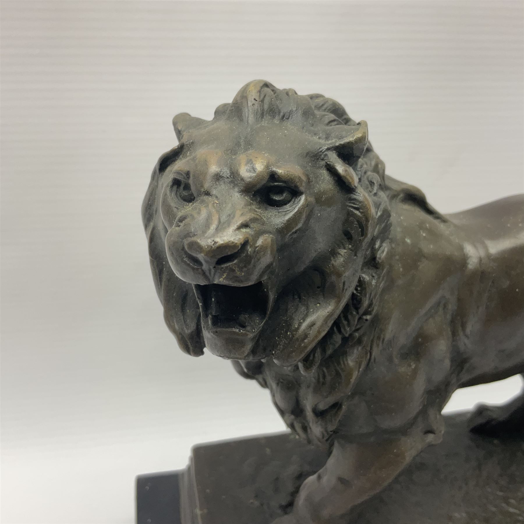 After Charles Valton, bronze, modelled as a lion, upon bronze plinth signed C H Valton, with foundry seal for J B Deposee, and black marble plinth base, overall H20cm L26cm