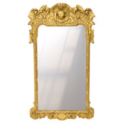 In the manner of Thomas Johnson - circa 1900 Georgian Revival giltwood wall mirror, the sh...