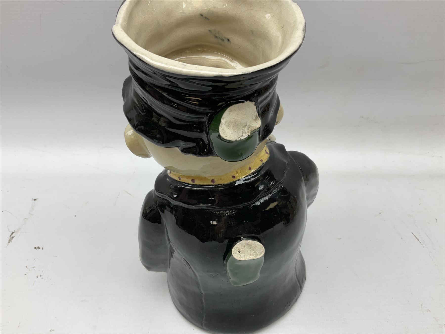 19th century and later Toby jugs comprising Staffordshire Punch and Judy jugs, Victorian 'I am on the black list' jug, two jugs in the form of Toby with a jug of beer (5)