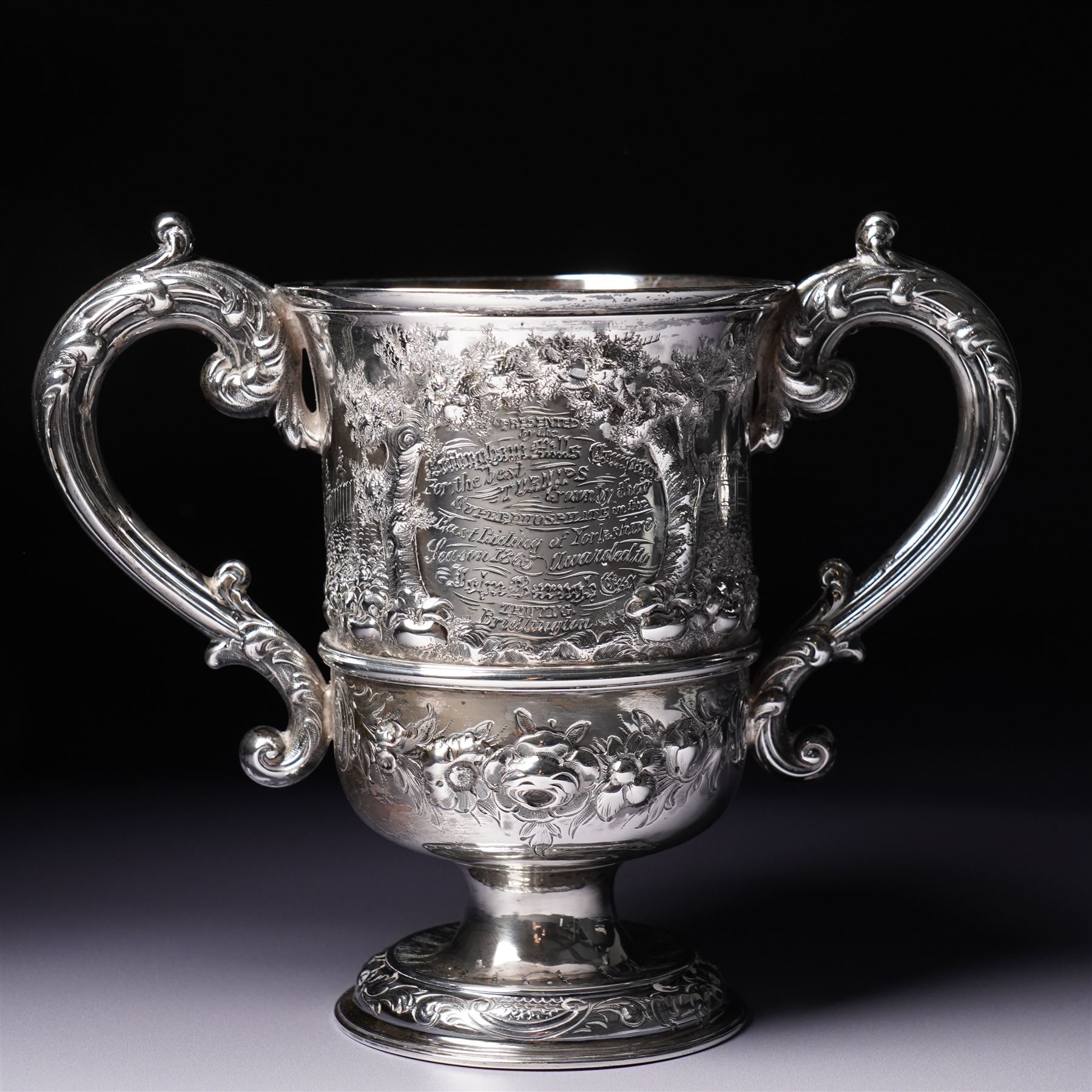 Victorian silver two handled cup embossed with cattle, horses and sheep and presented by Nottingham Mills Company to John Barugh, Thwing H16cm London 1865 Maker Henry Hollannd
