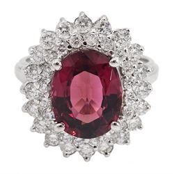 White gold oval tourmaline and round brilliant cut diamond cluster ring, stamped 14K, total diamond weight approx 1.70 carat, tourmaline approx 6.00 carat