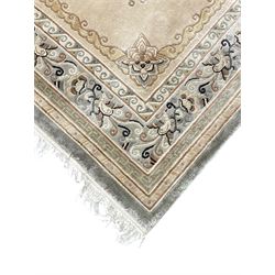 Chinese washed woollen camel ground rug, circular medallion surrounded by scrolls, the border decorated with birds and trailing floral decoration (248cm x 155cm); Chinese washed woollen pale green ground rug (125cm x 69cm); Persian design rug (186cm x 121cm) (3)