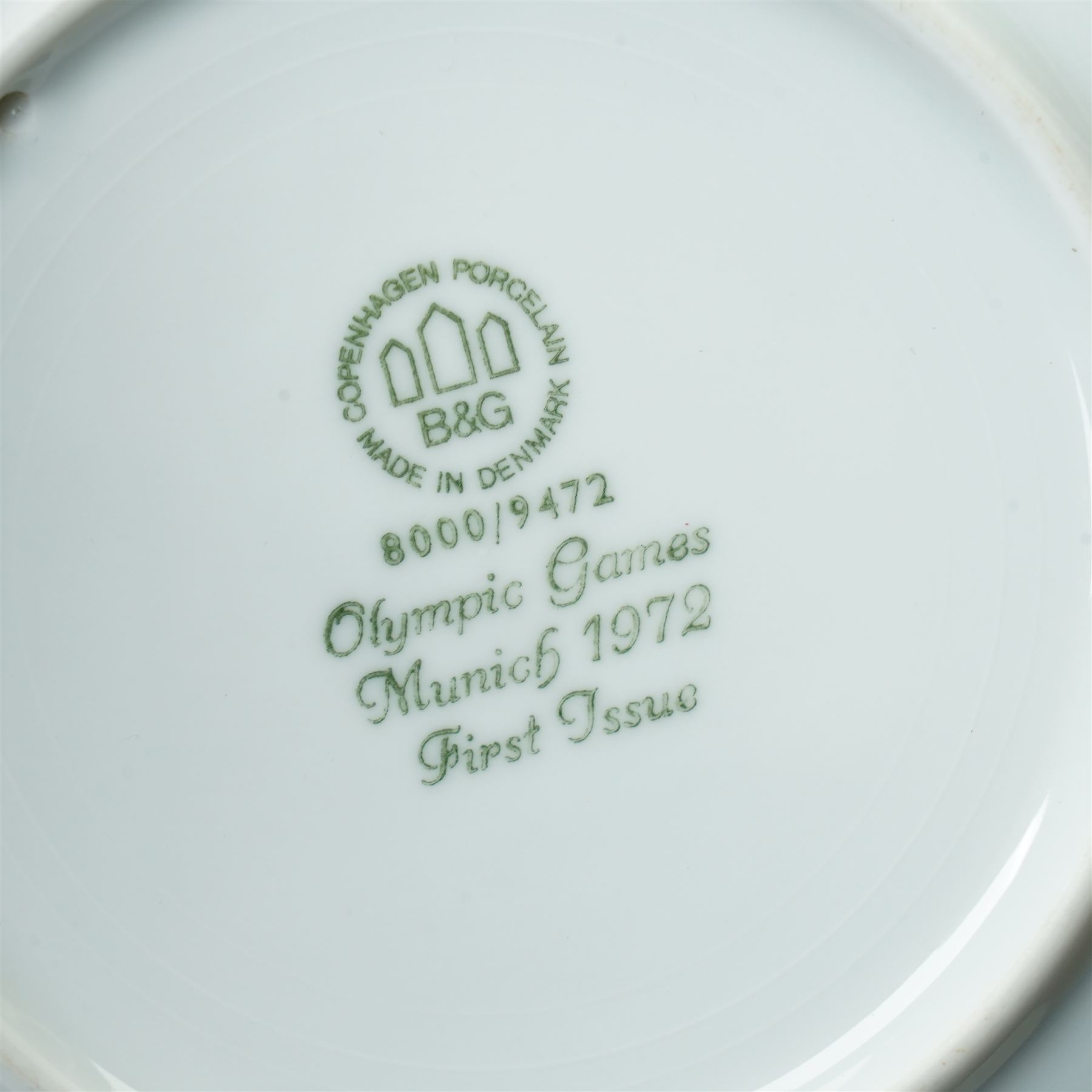 Royal Copenhagen onion pattern low comport, three breakfast cups and five saucers, oval platter, four tea plates, Munich 1972 Olympics plate, and four other blue and white items