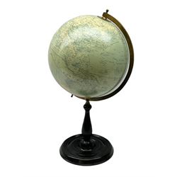 Terrestrial globe by Grinell, Washington, mounted on a brass half meridian and raised on turned wood pedestal base, H55cm