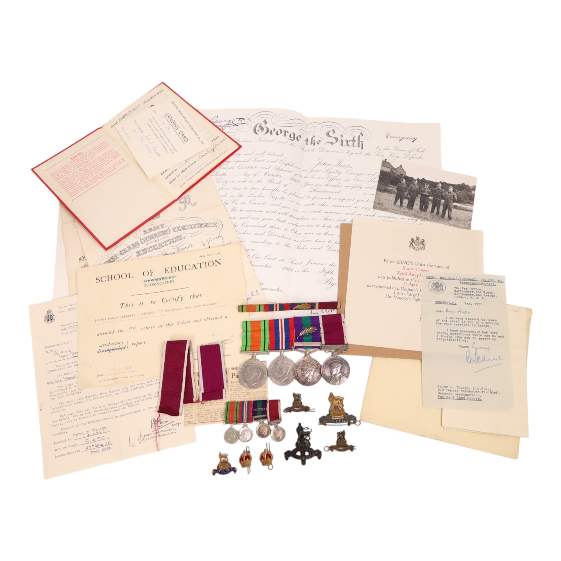 WWII medal set, comprising Defence medal, War medal, General Service medal with Malaya clasp and oak leaf, and Long Service And Good Conduct medal, awarded to Major J Troops. R.A.P.C, together with the matching miniatures, medal bar, Royal Army Pay Corps cap badges and ephemera relating to J Troops       