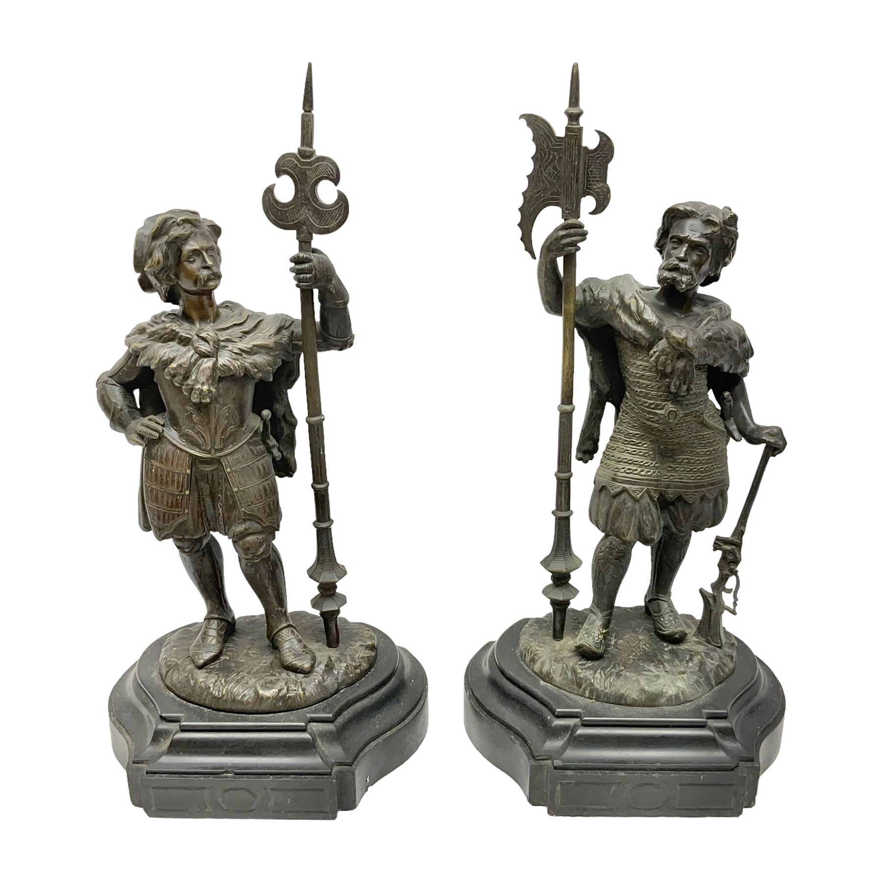 Pair of bronzed figure modelled as a hunter in traditional dress, each holding a pike, H48cm