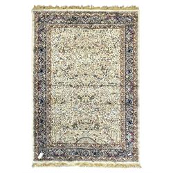 Persian Kerman ivory ground rug, the fie