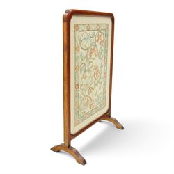 Victorian mahogany firescreen, rounded rectangular frame inset with embroidered panel depicting exotic birds amongst scrolling flowering foliage and butterflies, on out-splayed feet