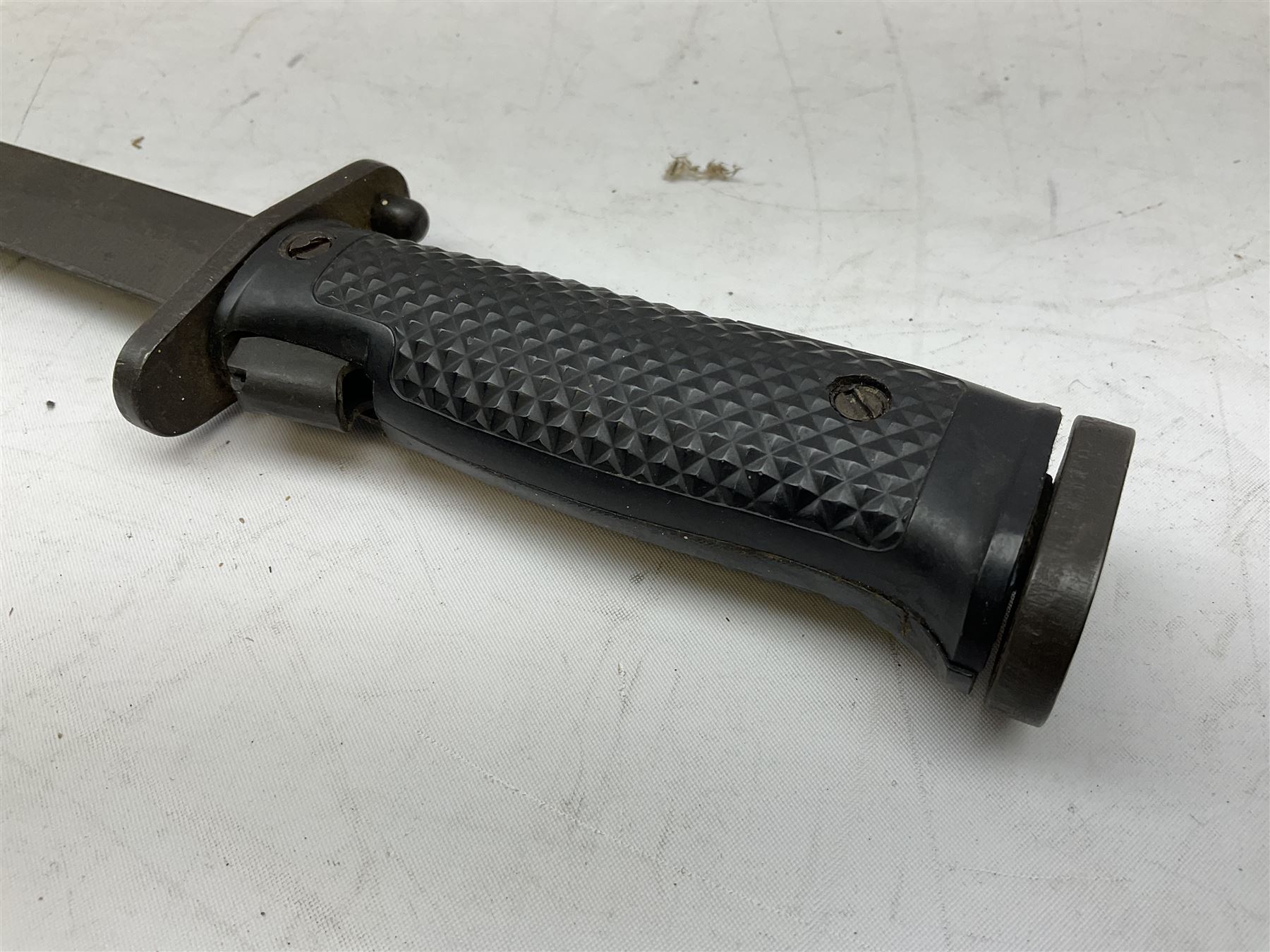 WW1 American Model 1917 Enfield bayonet by Remington with 43cm fullered steel blade; in leather scabbard with frog L59cm overall; and American M5A1 knife bayonet marked MILPAR COL to the cross-piece (no scabbard) (2)