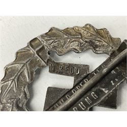 Two WW2 German Sports badges - SA sports badge marked verso 'W.Redo Eigentum D. Obersten SA. Fuhrung Saar Lautern'; and DRL sports badge marked verso 'Wernstein Jena D.R.G.M. 35269' (2)