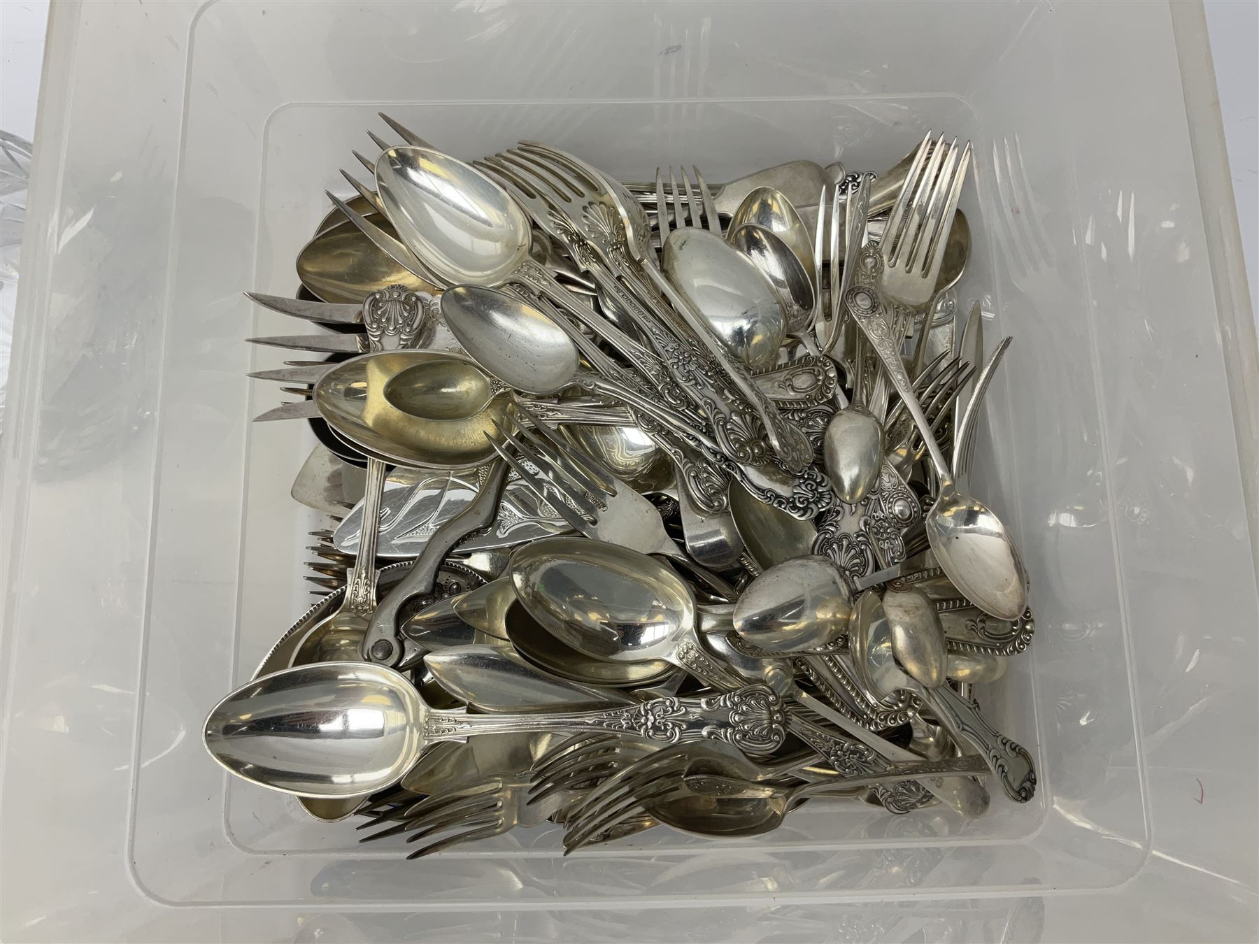 Quantity of assorted silver plated and other flatware, to include part sets, set of three silver plated cruets, glass sifter with silver plated cover, two glass decanters and stoppers, etc., in one box 
