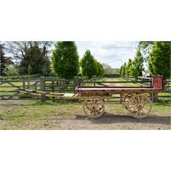 Advertising Trade Dray Wagon for C. Herring & Son, Hartlepool, Dated 1895 and Renovated 1975

An exceptionally decorative late Victorian horse drawn advertising trade dray, built by J. Herring of Hartlepool in 1895 and later renovated by C. Herring in 1975, as recorded by the painted inscription beneath the body. Finished in a striking cream and maroon livery with extensive hand painted signwriting, the wagon carries the name C. Herring & Son, Iron & Steel Processors, Hartlepool along its sides and rear panels. The wagon is fitted with a flat timber loading bed, twin shafts for a single horse, elegant spoked wooden wheels, iron bound tyres, rear headboard and traditional undercarriage with leaf spring suspension. Richly detailed scrollwork and lining throughout make this a particularly attractive example, suitable for collection, display, museum, promotional or coaching purposes.

Features

• Built by J. Herring, Hartlepool, 1895
• Renovated by C. Herring in 1975
• Original style hand painted advertising signwriting
• Flat timber loading platform
• Raised rear headboard with decorative pierced gallery
• Twin shafts for a single horse
• Wooden spoked wheels with iron tyres
• Traditional leaf spring suspension
• Extensive decorative lining and scrollwork throughout
• Attractive cream and maroon colour scheme
• Suitable for private collection, museum or display use

Dimensions:
Overall length: 560 cm
Body length: 300 cm
Width: 158 cm
Height: 150 cm

Wheel Diameters:
Front wheels: 76 cm
Rear wheels: 86 cm