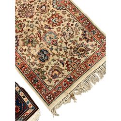 Persian Hamadan red and blue ground rug, the field with geometric pole medallion, guarded border with trailing band and repeating geometric motifs (160cm x 86cm); and a sand ground rug decorated with floral Herati motifs (180cm x 89cm)