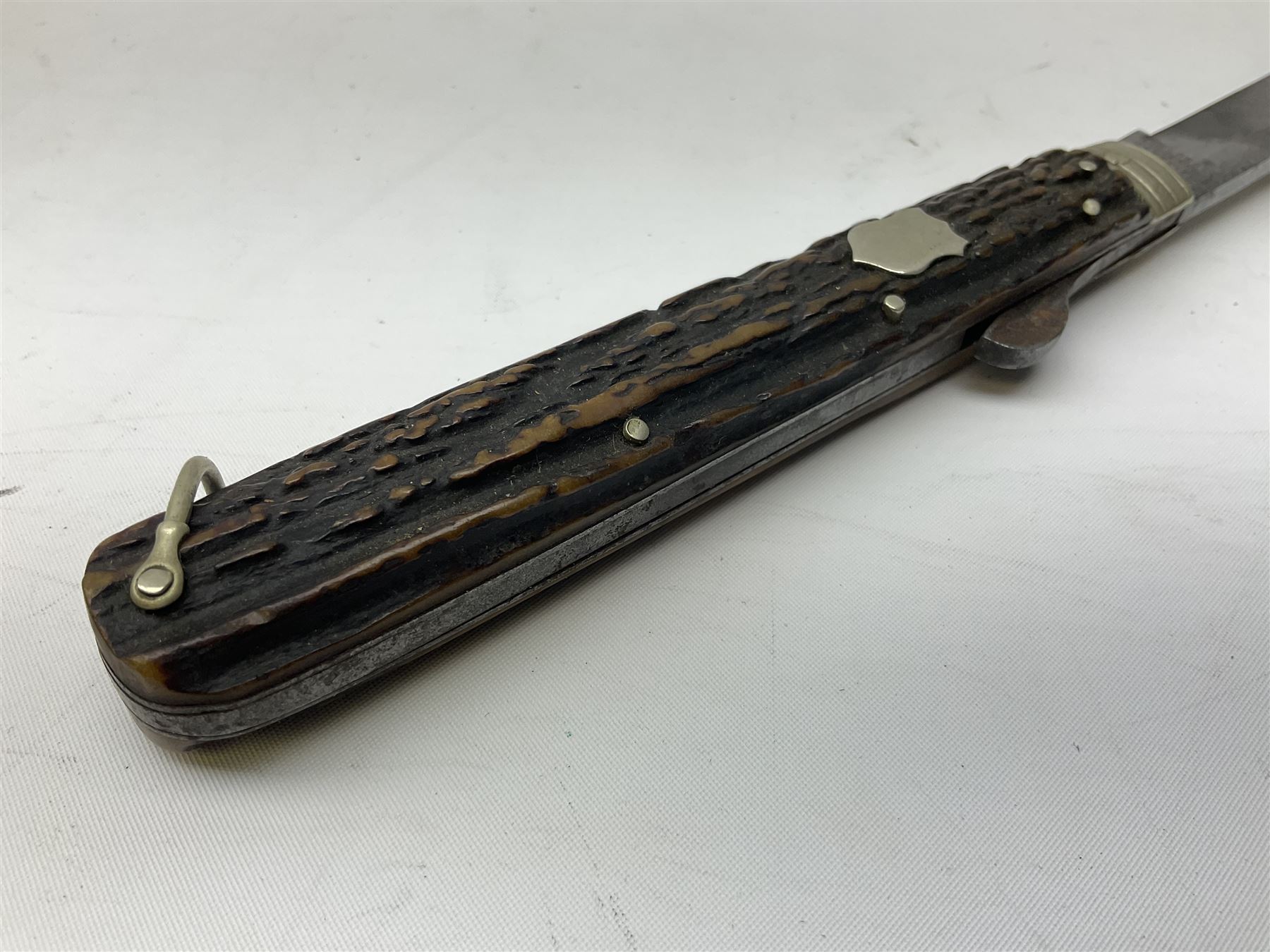 Hunting knife by J Nowill & Sons, Sheffield, the handle inset with mother of pearl, blade length 19cm; George Wolstenholme IXL lock-knife with antler scales L29cm open; and another Bowie style hunting knife marked 'V.R. Warranted Sheffield Joseph Ellis & Sons' in leather sheath (3)