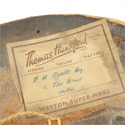 Black top hat by TB & W Cockayne in leather hat box 