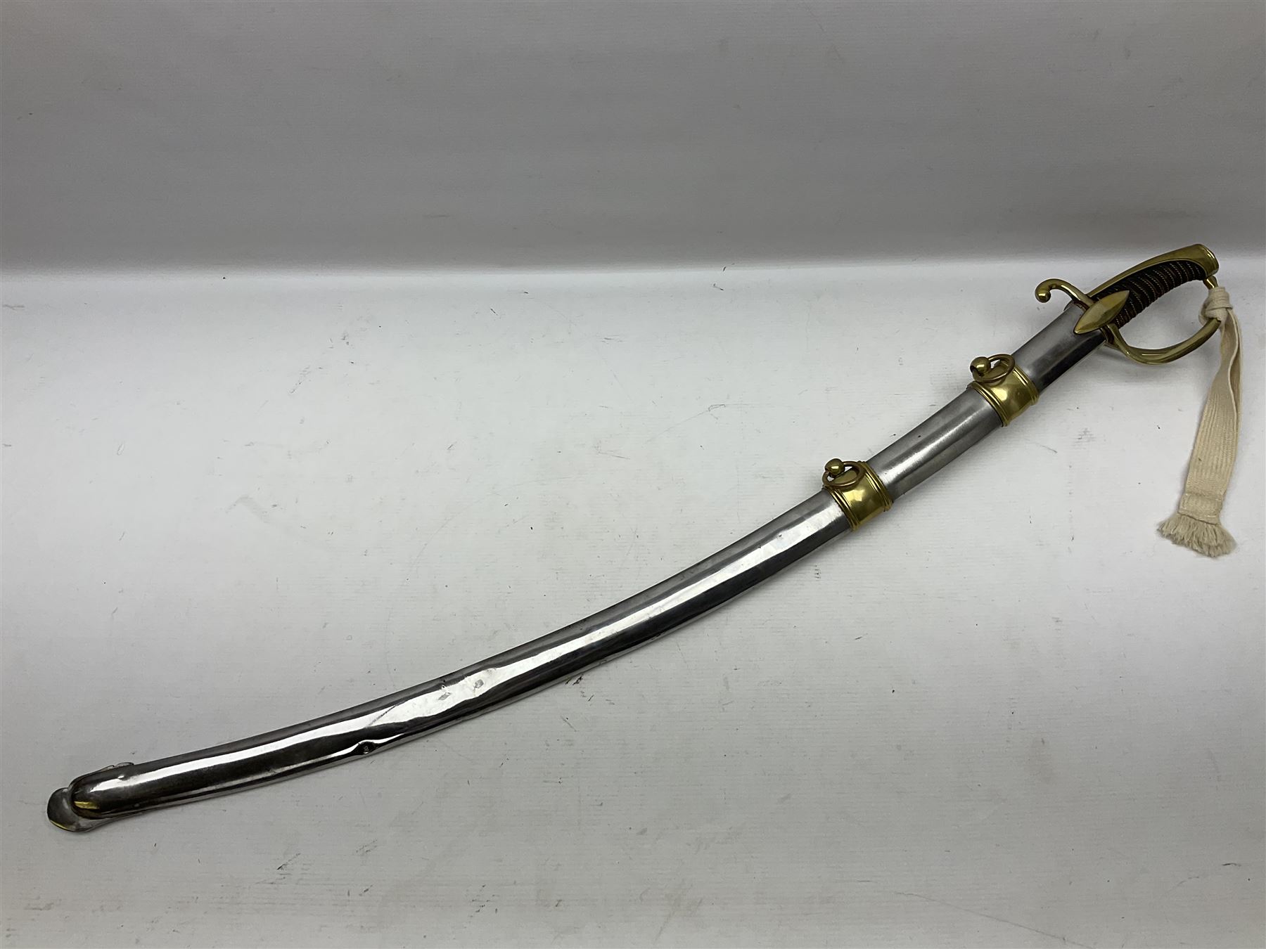 19th century French Chasseur a Cheval de la Guard trooper's sword with 86.5cm slightly curving fullered blade, brass three-bar hilt with elongated elliptical langets and wire-bound leather grip; in polished steel scabbard with two brass suspension rings L104cm overall