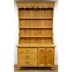  Solid pine kitchen dresser, three shelf back, two cupboard doors, three graduating drawers, turned supports, W122cm, H215cm, D48cm  