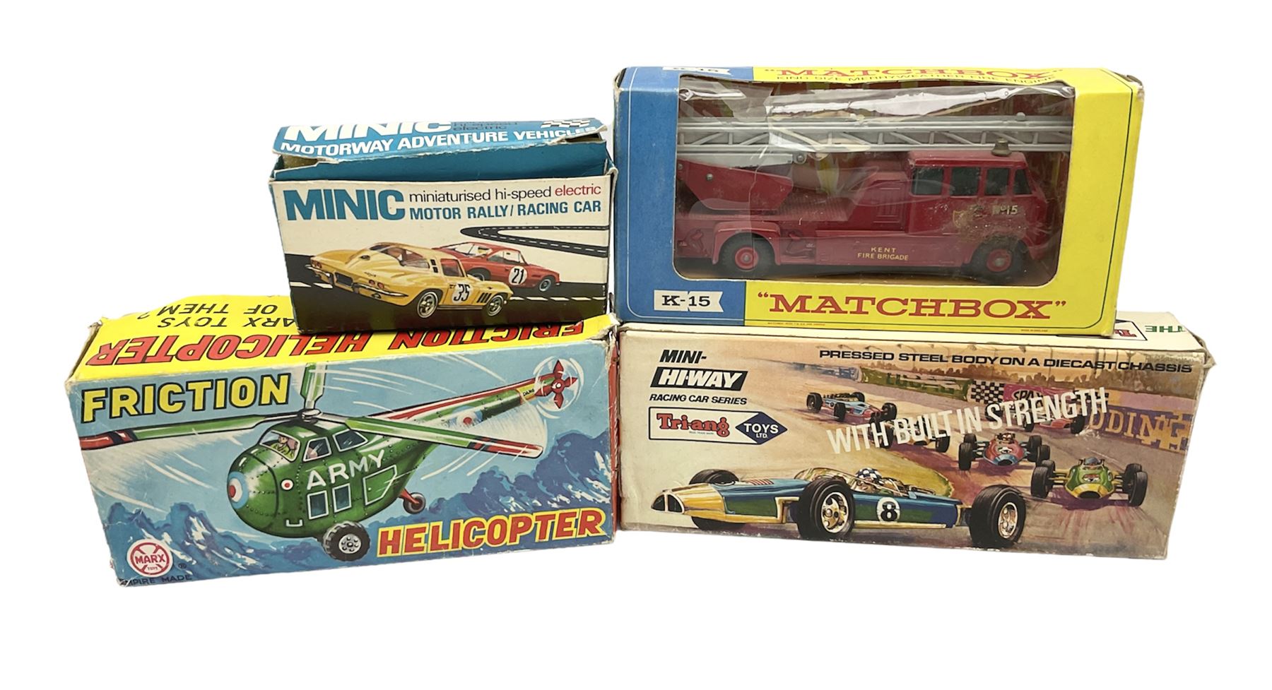 Various makers - Tri-ang Mini-Hi-Way Racing Car Series Le Mans No.9 racing car; Matchbox K-15 Merryweather Fire-Engine; Marx tin-plate Friction Helicopter; all boxed; and a Minic Motor Rally Adventure box containing a Jaguar Police car for spares or repair (4)