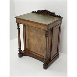 Early Victorian figured mahogany dressing cabinet, the raised shell and scroll carved back lifts to reveal rectangular easel mirror with mahogany band, flat rectangular top with tooled leather inset, slide at each side with matching leather inset, full width drawer above cupboard enclosing a series of five drawers, turned front supports, panelled front, sides and back