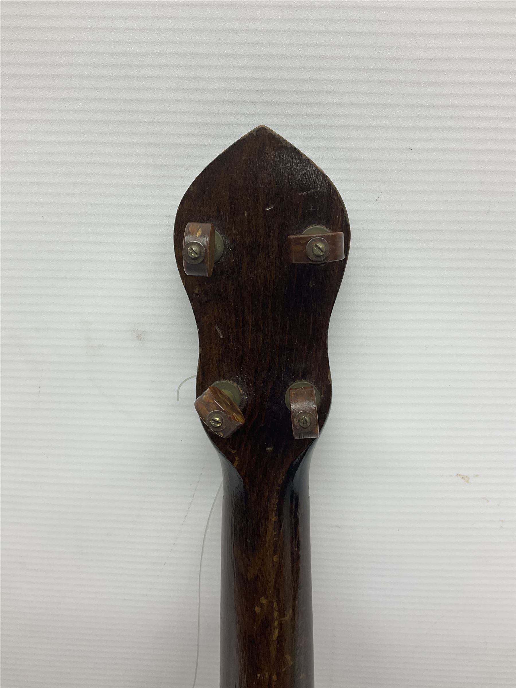 George Formby banjolele with metal plaque to headstock L55cm; in carrying case with instruction booklet.