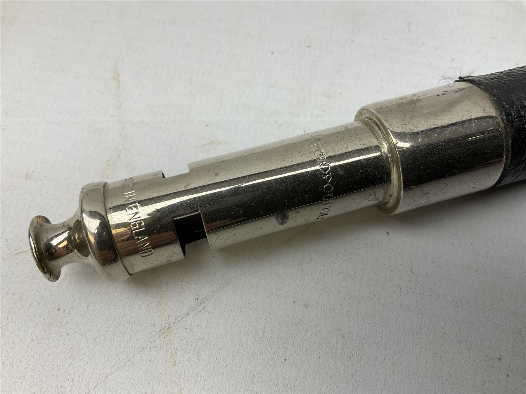 ‘The Metropolitan’ Police ebonised and black leather swagger stick, with combined whistle, 60cm