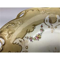 Victorian porcelain comport, the shaped dish with pierced rim and twin handles, decorated in the manner of Coalport with floral swags, buff border, and heightened with gilt, not including handles H18cm D30cm