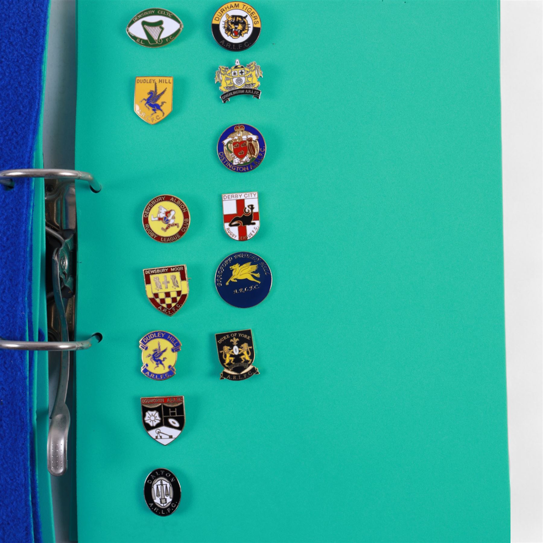 Amateur rugby league enamel badge collection, teams including Birmingham Bulldogs, Bridlington, Dudley Hill, Duke of York, Edinburgh Eagles, Guiseley, Rangers, Huntingdon, Keighley Town, Leigh Miners, Pilkington Recs, St Josephs, Thornhill Trojans, West London Sharks etc, all displayed in three folders and six amateur league badges from Leeds & District, Hull & District, York & District, Warrington, Lancashire County and Yorks County in box display, (approximately 270)