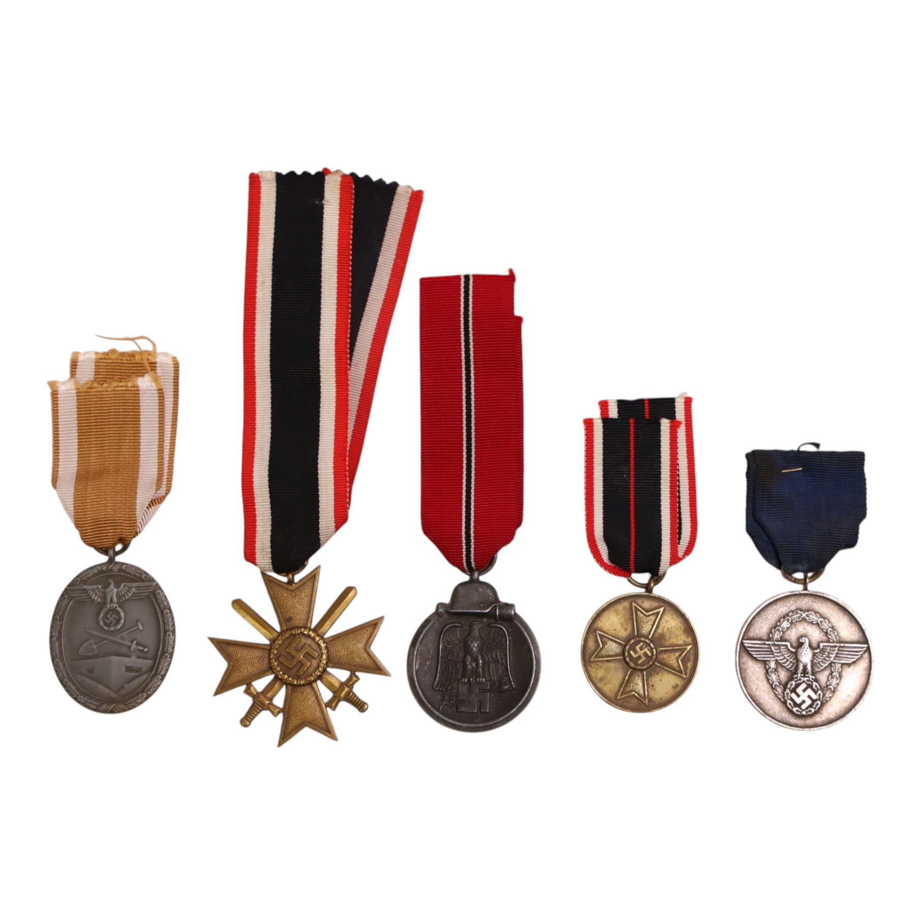 WWII Third Reich medals, comprising Eastern Front medal, Police 8 year long service medal, Western wall medal, War merit cross 2nd class with swords and War merit medal 