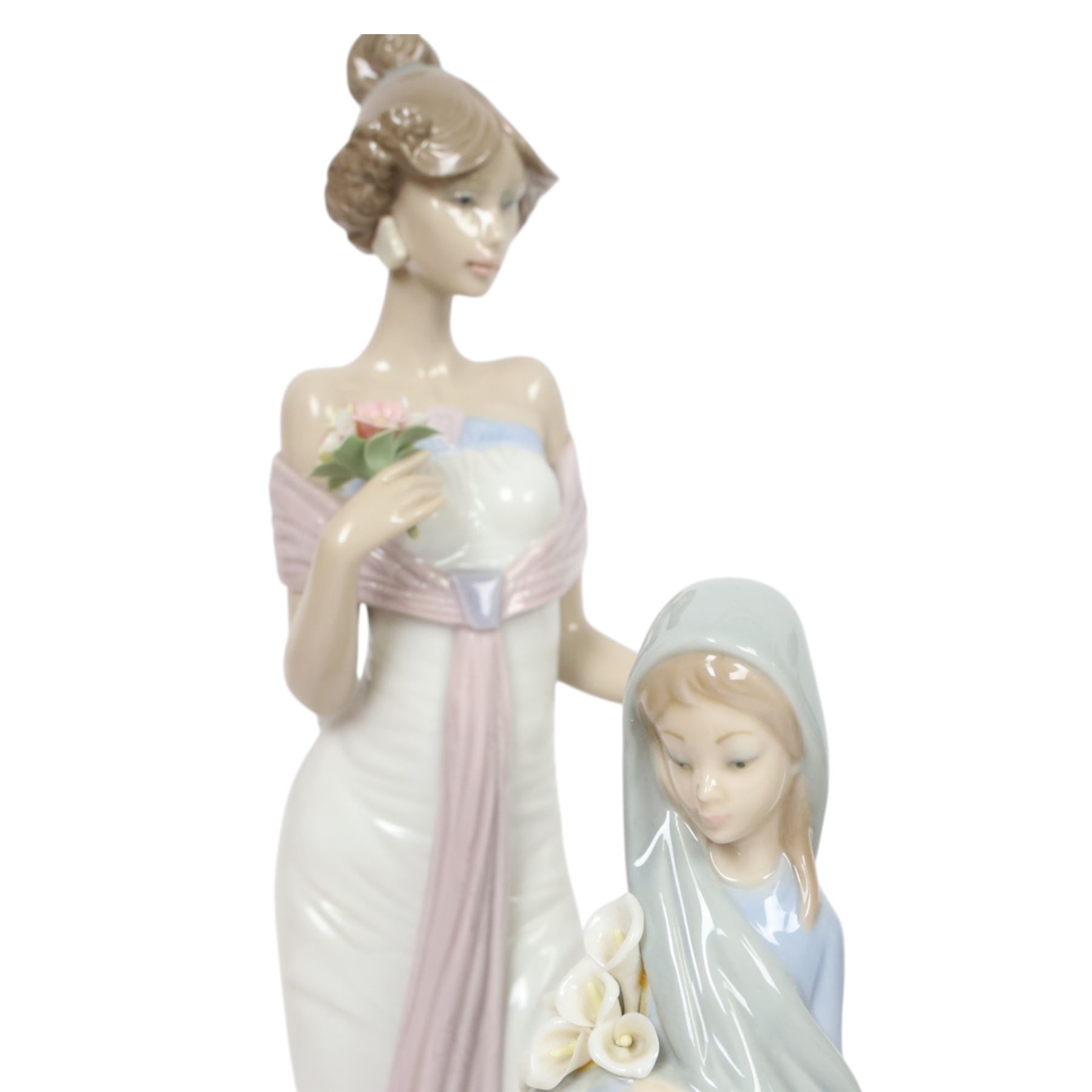 Four Lladro figures, comprising Summer Infatuation 6366, Butterfly Treasures 6777, Girl with Calla Lilies 4650 and Shepherdess with Dog 1034